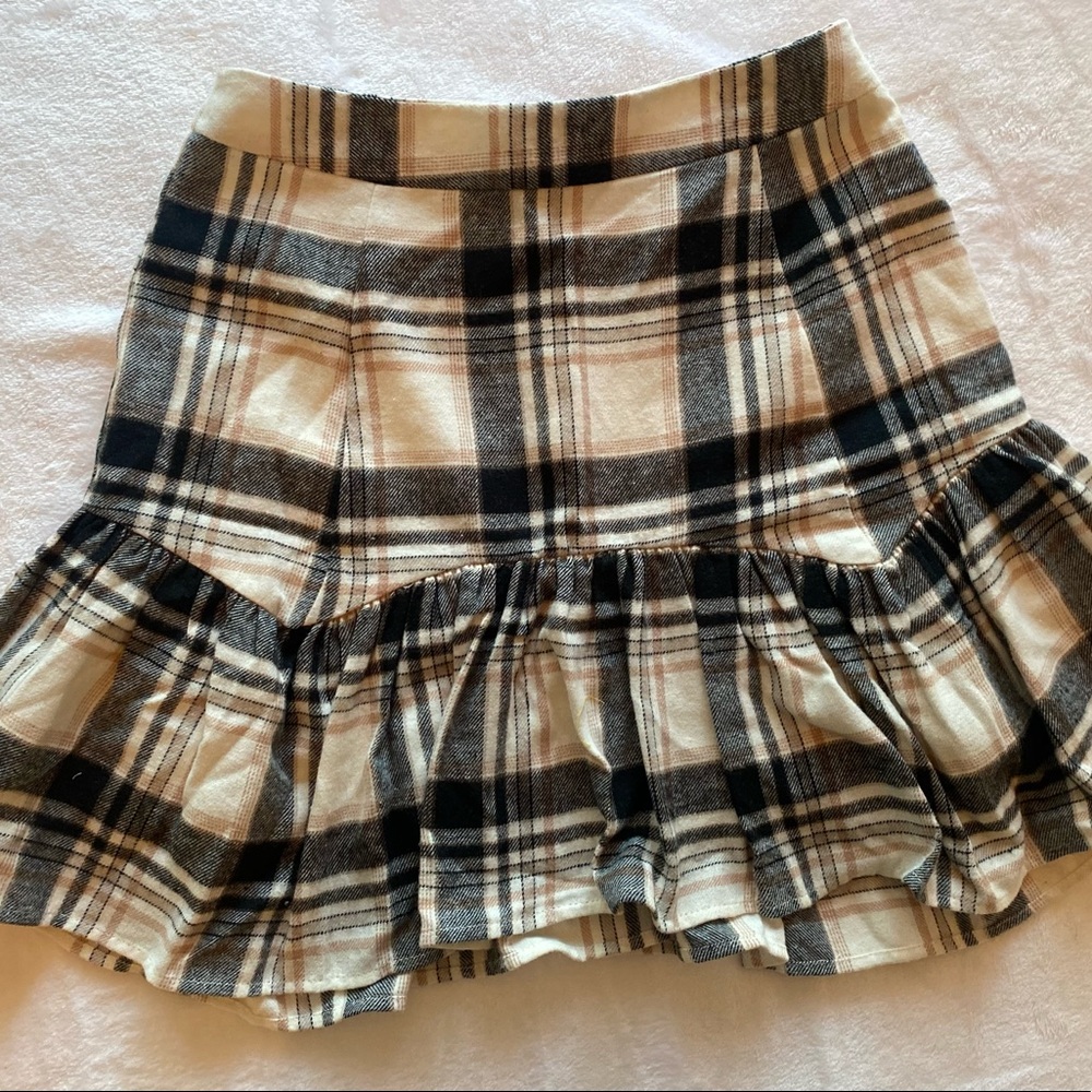 cream and black plaid skirt.